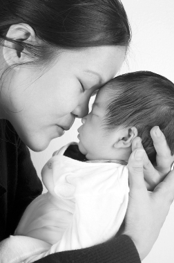 Asian mother with cherished baby